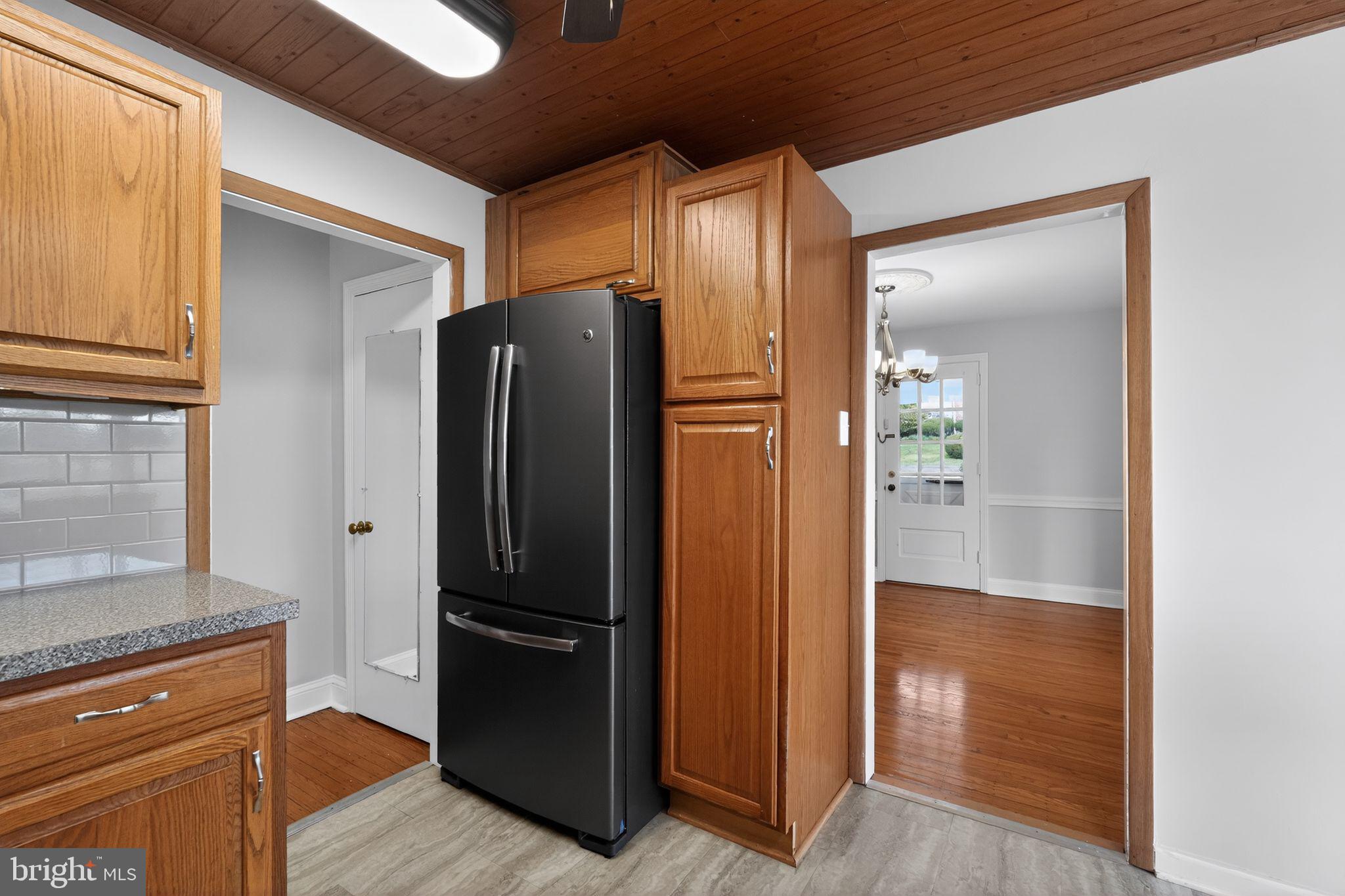 517 Weymouth Road Springfield, PA 19064 - Photo 15 of 31 a view of kitchen with refrigerator and wooden floor