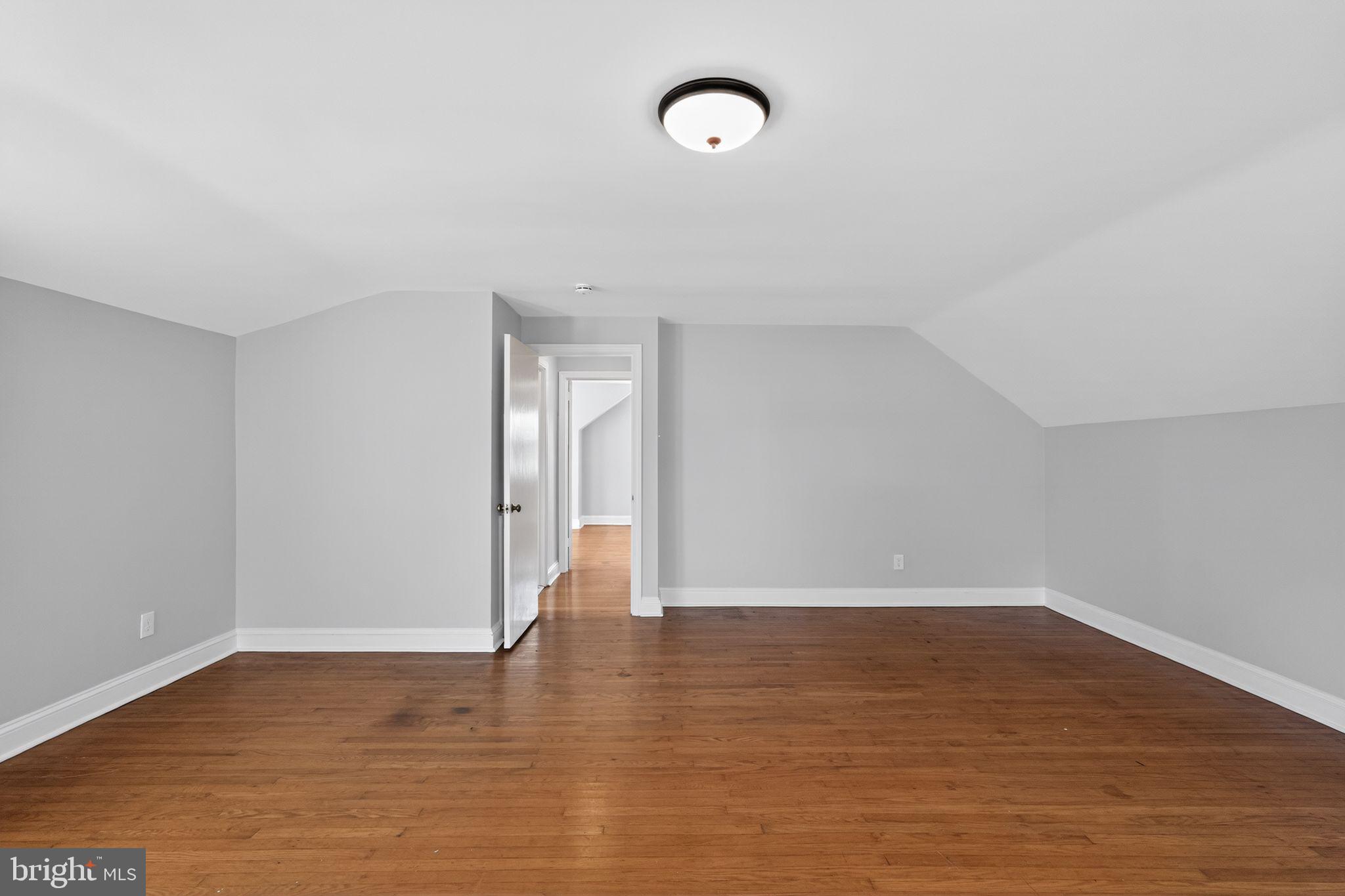 517 Weymouth Road Springfield, PA 19064 - Photo 22 of 31 a view of an empty room with wooden floor