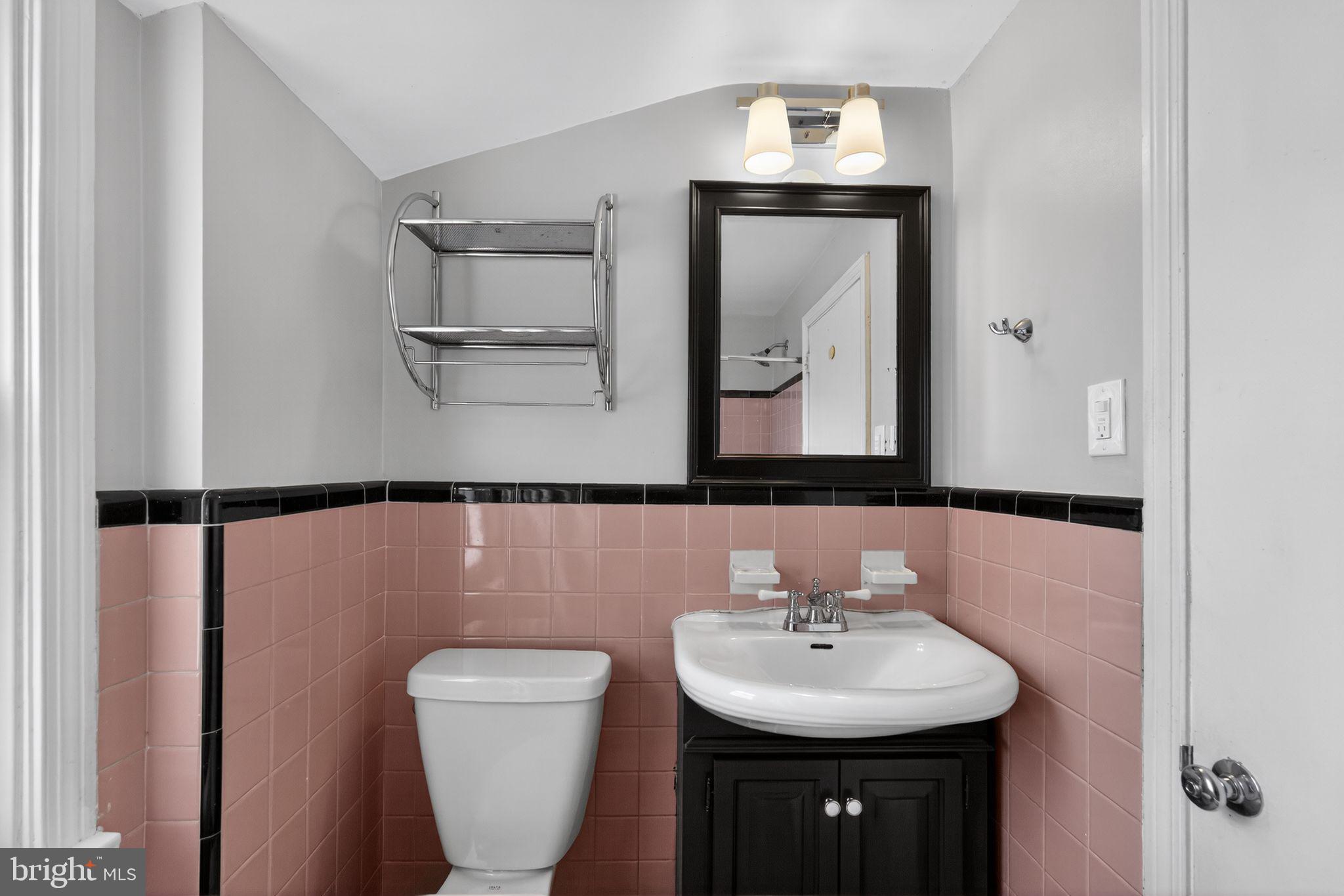 517 Weymouth Road Springfield, PA 19064 - Photo 25 of 31 a bathroom with a toilet sink and mirror