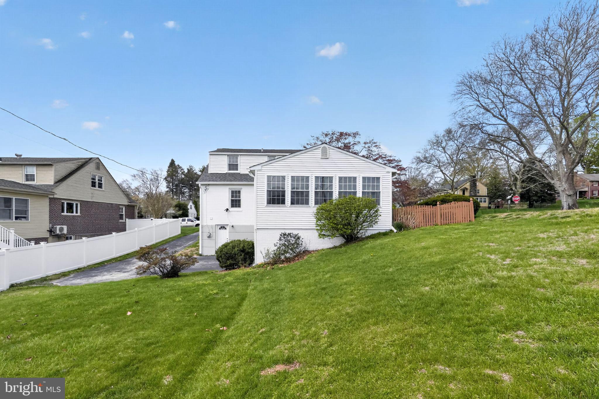 517 Weymouth Road Springfield, PA 19064 - Photo 29 of 31 a view of a house with a big yard and large trees