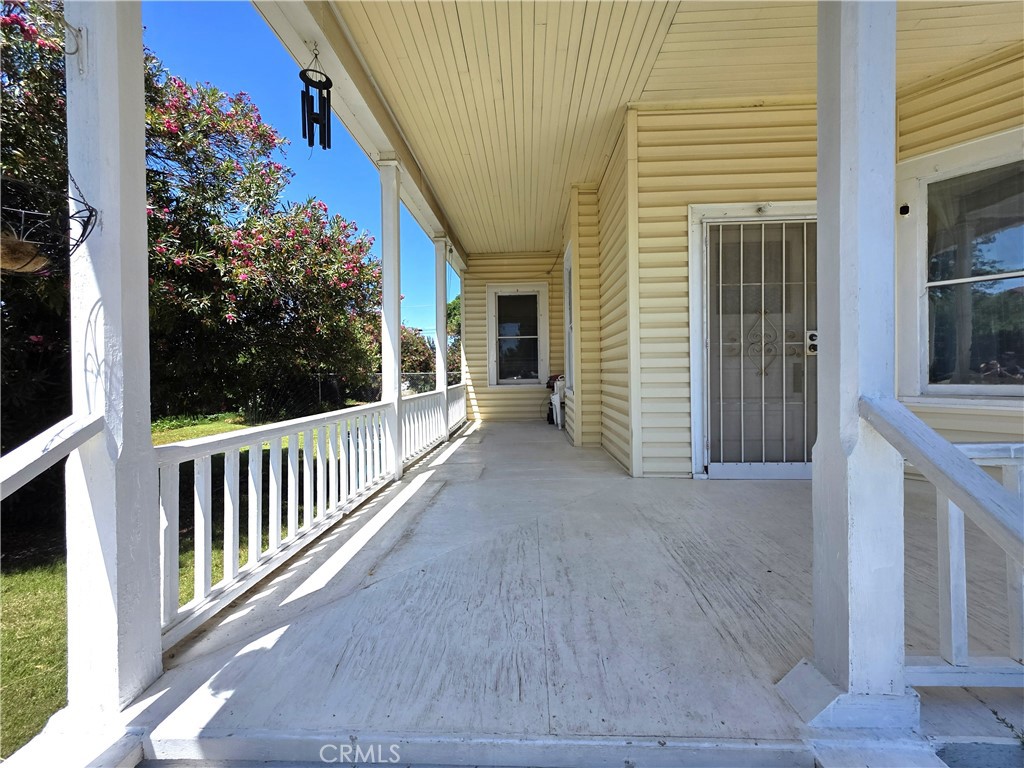 1414 Marin Street Corning, CA 96021 - Photo 41 of 43 a view of a house with porch and wooden floor