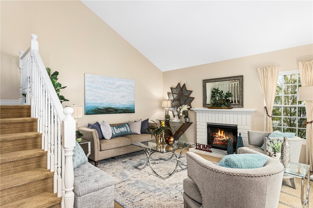 17 Racing Wind Irvine, CA 92614 - Photo 1 of 1 a living room with furniture and a fireplace