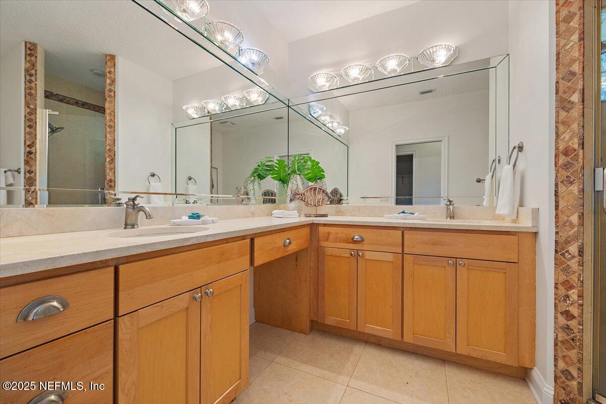 2049 Seminole Road Atlantic Beach, FL 32233 - Photo 15 of 20 a bathroom with a sink and a mirror