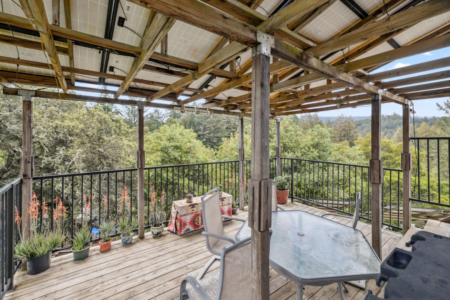 234 Dorrance Road Boulder Creek, CA 95006 - Photo 18 of 45 a balcony with hardwood filled with furniture