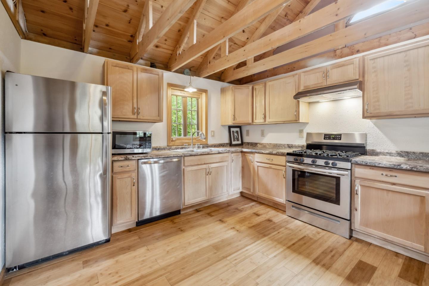 234 Dorrance Road Boulder Creek, CA 95006 - Photo 22 of 45 a kitchen with white cabinets and white appliances