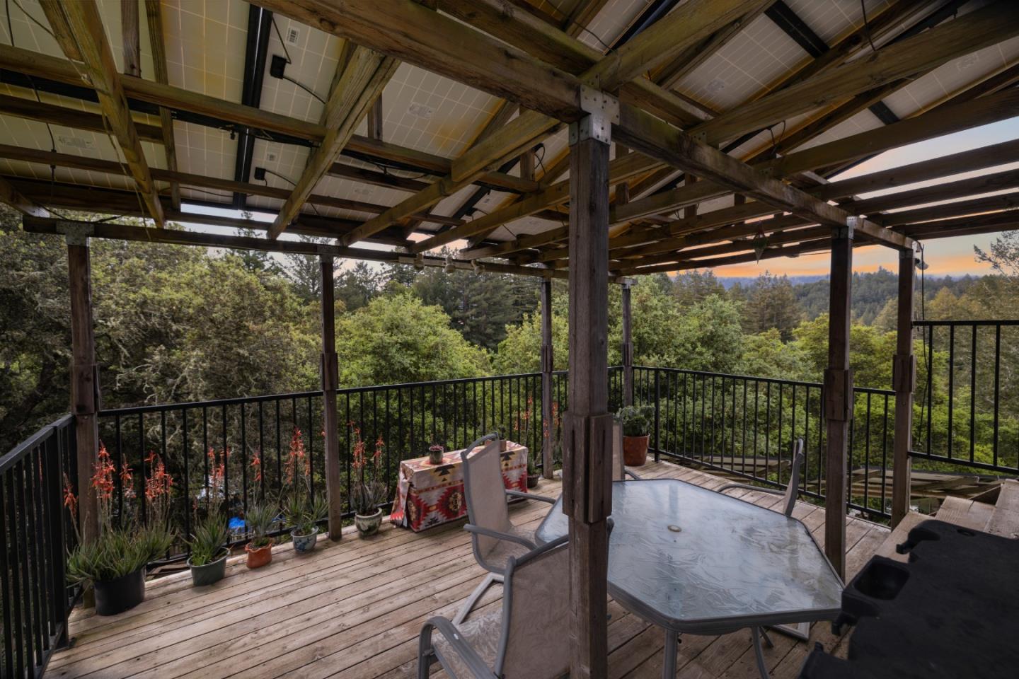 234 Dorrance Road Boulder Creek, CA 95006 - Photo 34 of 45 a view of a balcony with chairs and wooden floor