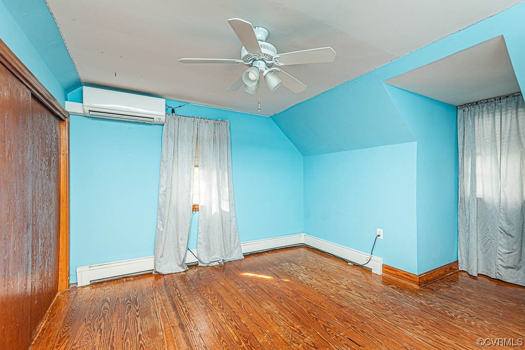 7418 Atlee Road Mechanicsville, VA 23111 - Photo 14 of 26 an empty room with a ceiling fan and wooden floor