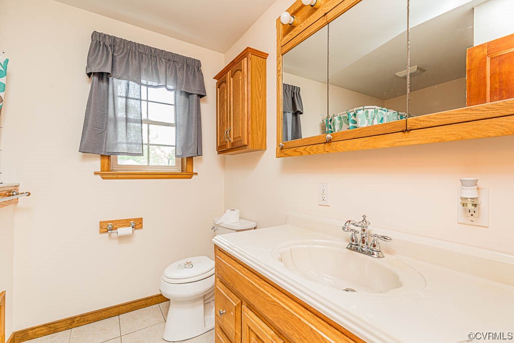 7418 Atlee Road Mechanicsville, VA 23111 - Photo 17 of 26 a bathroom with a sink a toilet and shower