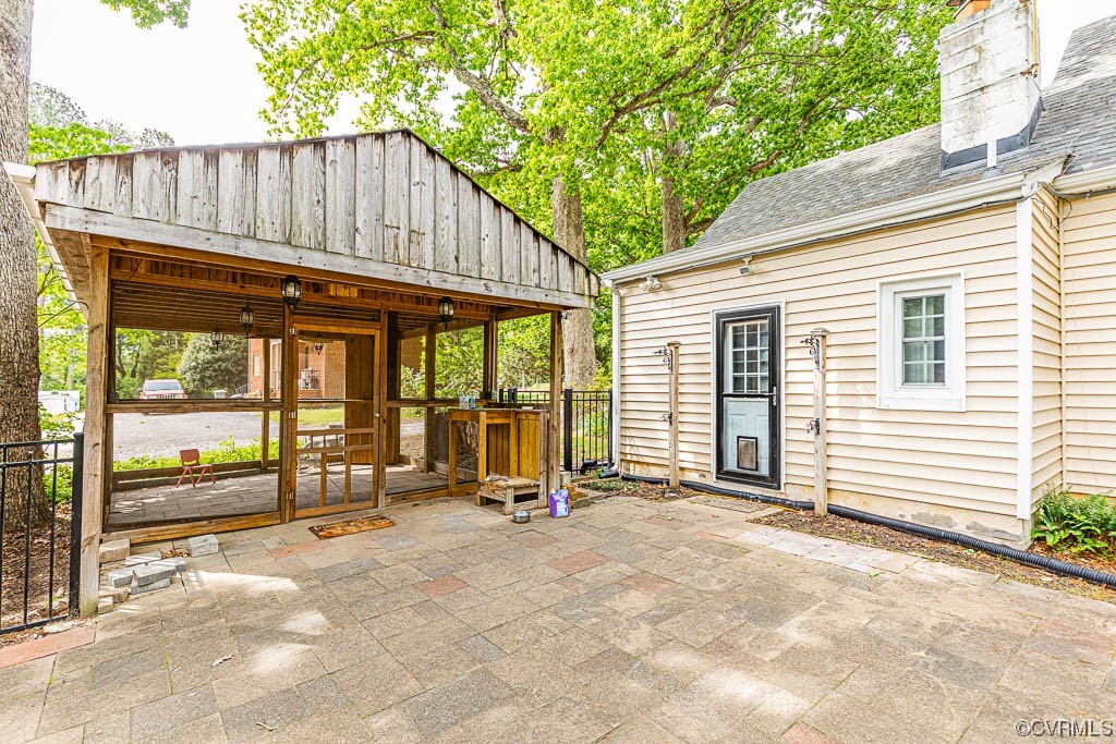 7418 Atlee Road Mechanicsville, VA 23111 - Photo 20 of 26 a view of a house with wooden floor and roof with a barbeque