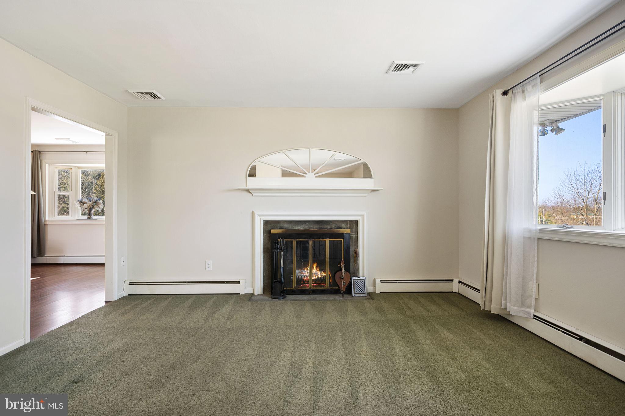 220 Coldstream Road Phoenixville, PA 19460 - Photo 17 of 41 Living room with wood burning fireplace