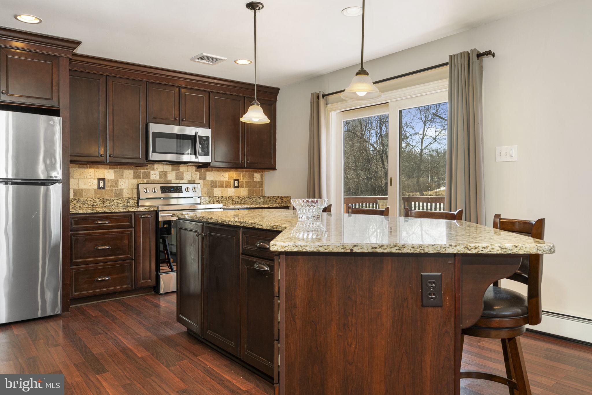220 Coldstream Road Phoenixville, PA 19460 - Photo 9 of 41 Granite Island with matching chairs