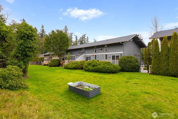 a view of a house with a backyard