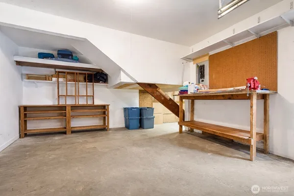 a bedroom with furniture and a window