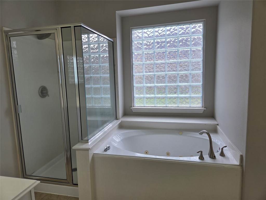 2203 Winchester Lake Rosenberg, TX 77471 - Photo 13 of 20 a bathroom with a bathtub and a shower