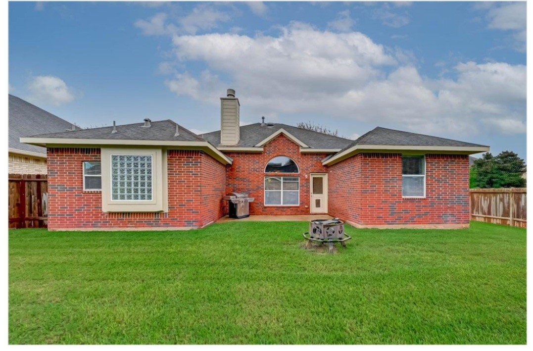 2203 Winchester Lake Rosenberg, TX 77471 - Photo 20 of 20 a front view of a house with a yard and garage