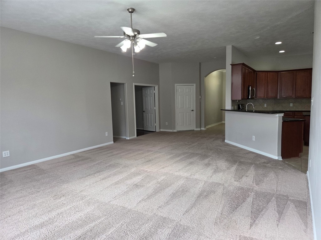 2203 Winchester Lake Rosenberg, TX 77471 - Photo 5 of 20 a view of a kitchen with a sink and chandelier