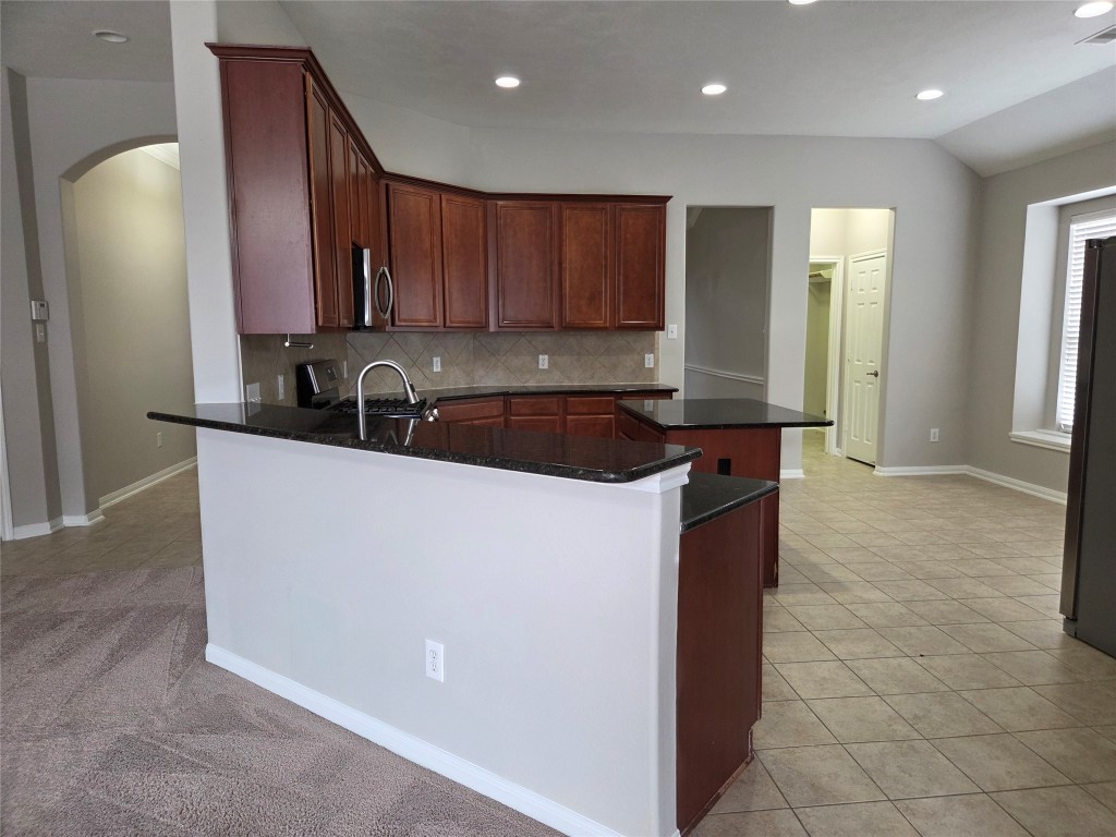 2203 Winchester Lake Rosenberg, TX 77471 - Photo 6 of 20 a kitchen with a sink and cabinets