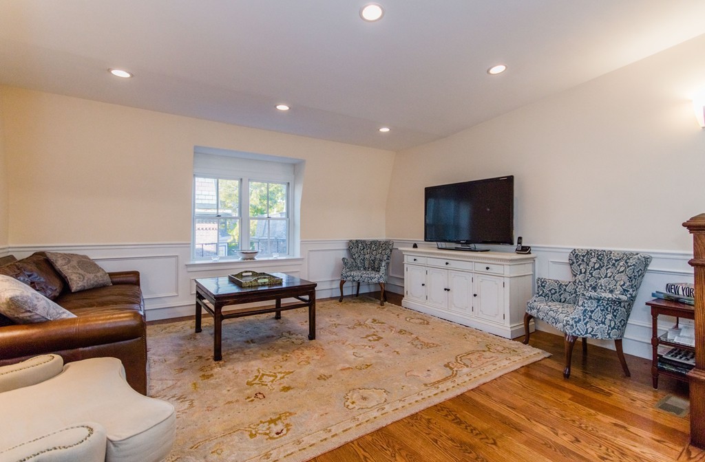 123 Warren Avenue, Unit 2 Boston, MA 02116 - Photo 3 of 13 a living room with furniture and a flat screen tv