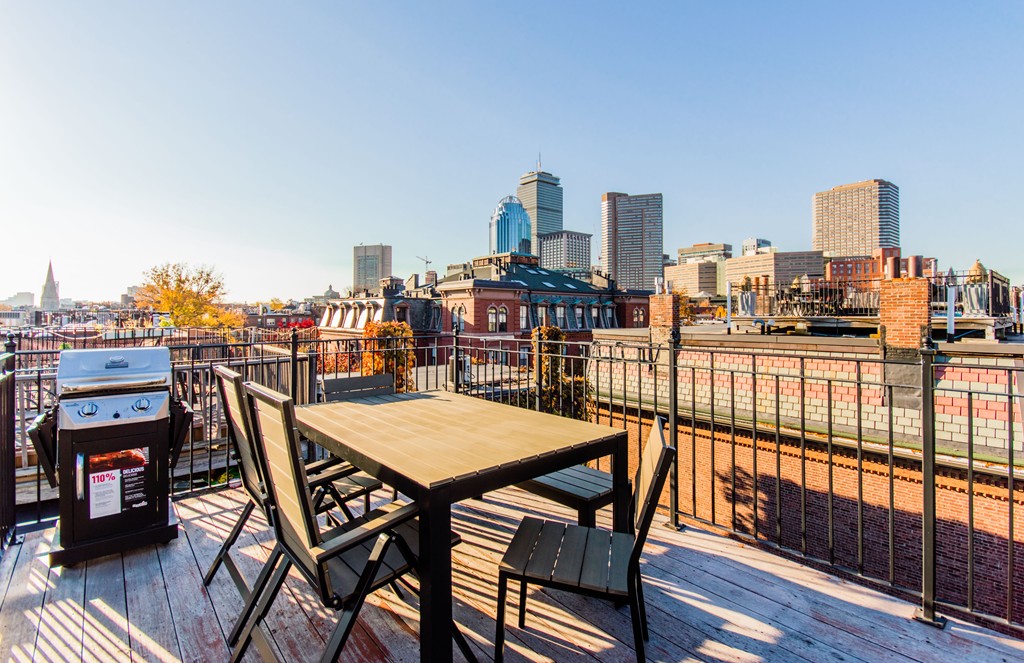 123 Warren Avenue, Unit 2 Boston, MA 02116 - Photo 6 of 13 a view of a balcony with a table and chairs