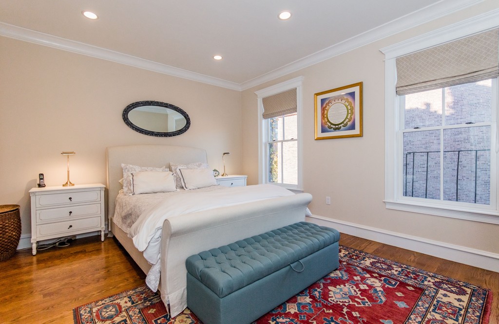 123 Warren Avenue, Unit 2 Boston, MA 02116 - Photo 8 of 13 a bedroom with a bed and a window