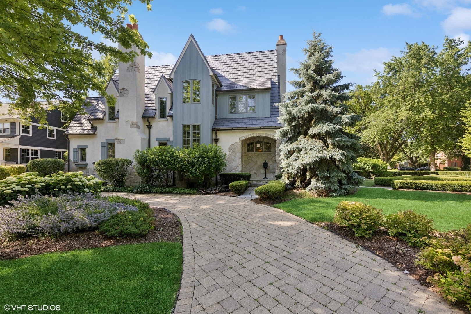 a front view of house with yard and green space