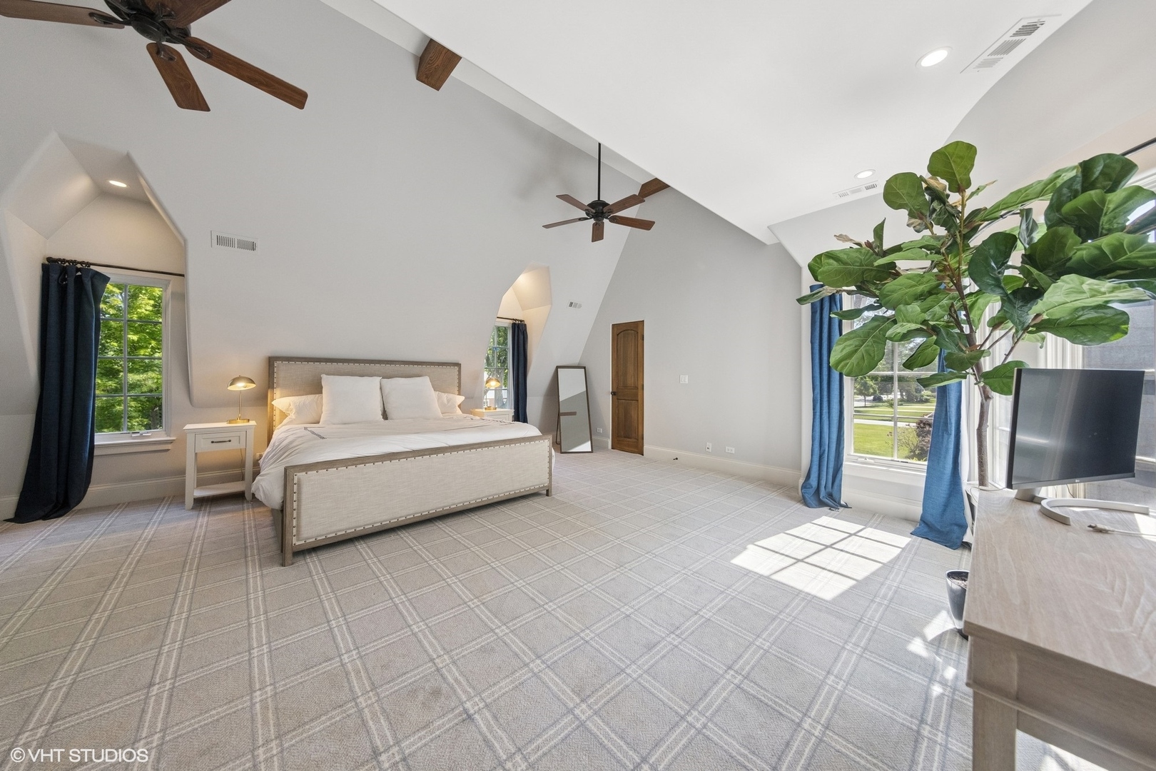 437 North County Line Road Hinsdale, IL 60521 - Photo 15 of 25 a bedroom with a bed table flowerpot and window