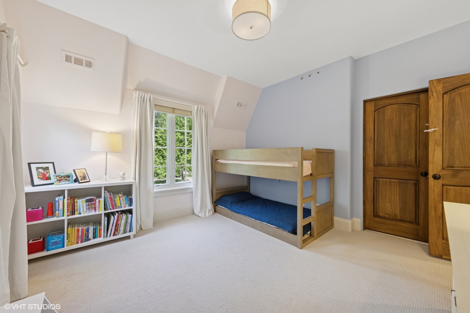 437 North County Line Road Hinsdale, IL 60521 - Photo 17 of 25 a bedroom with bed and a book shelf