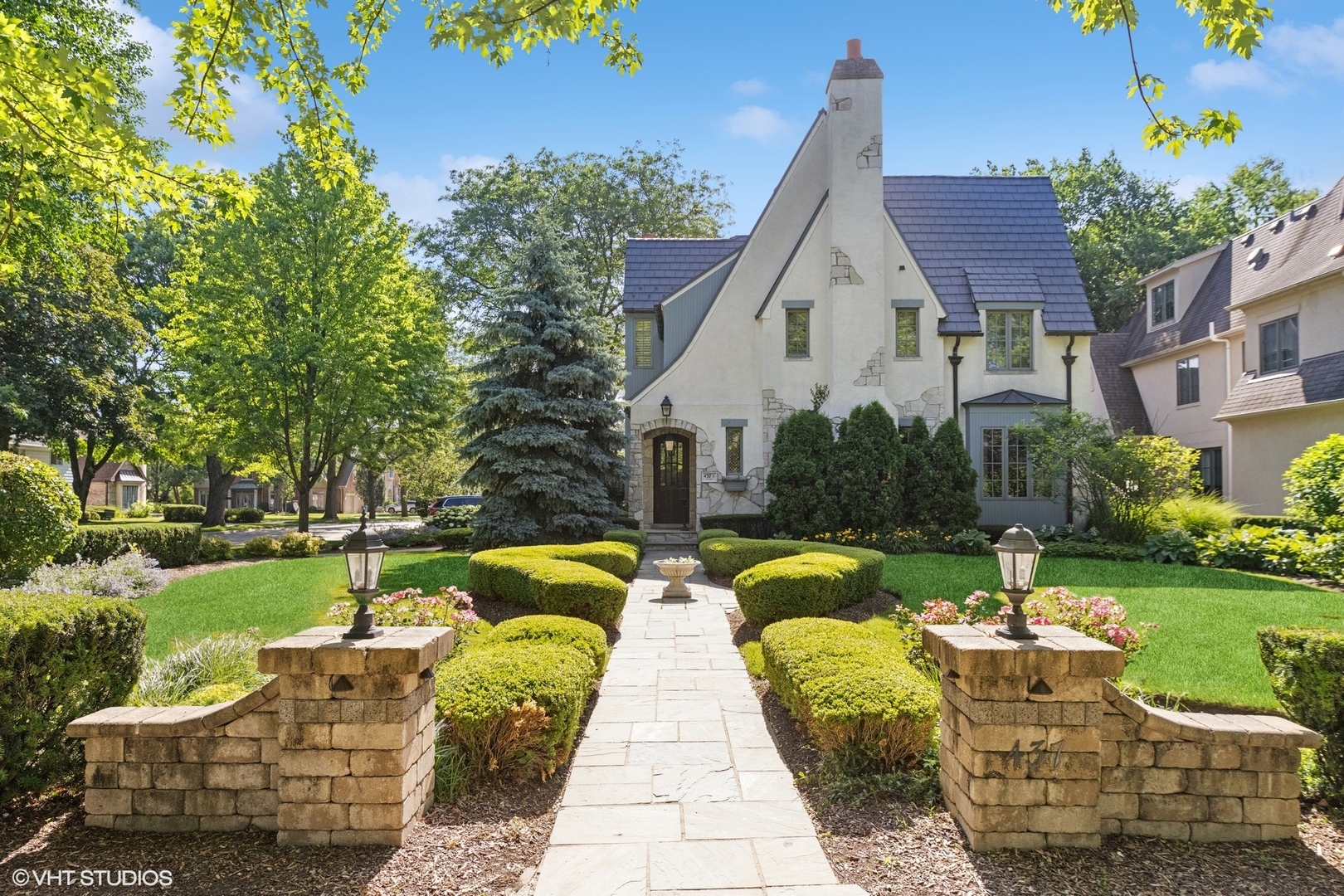 437 North County Line Road Hinsdale, IL 60521 - Photo 2 of 25 a view of a patio with couches chairs and a yard