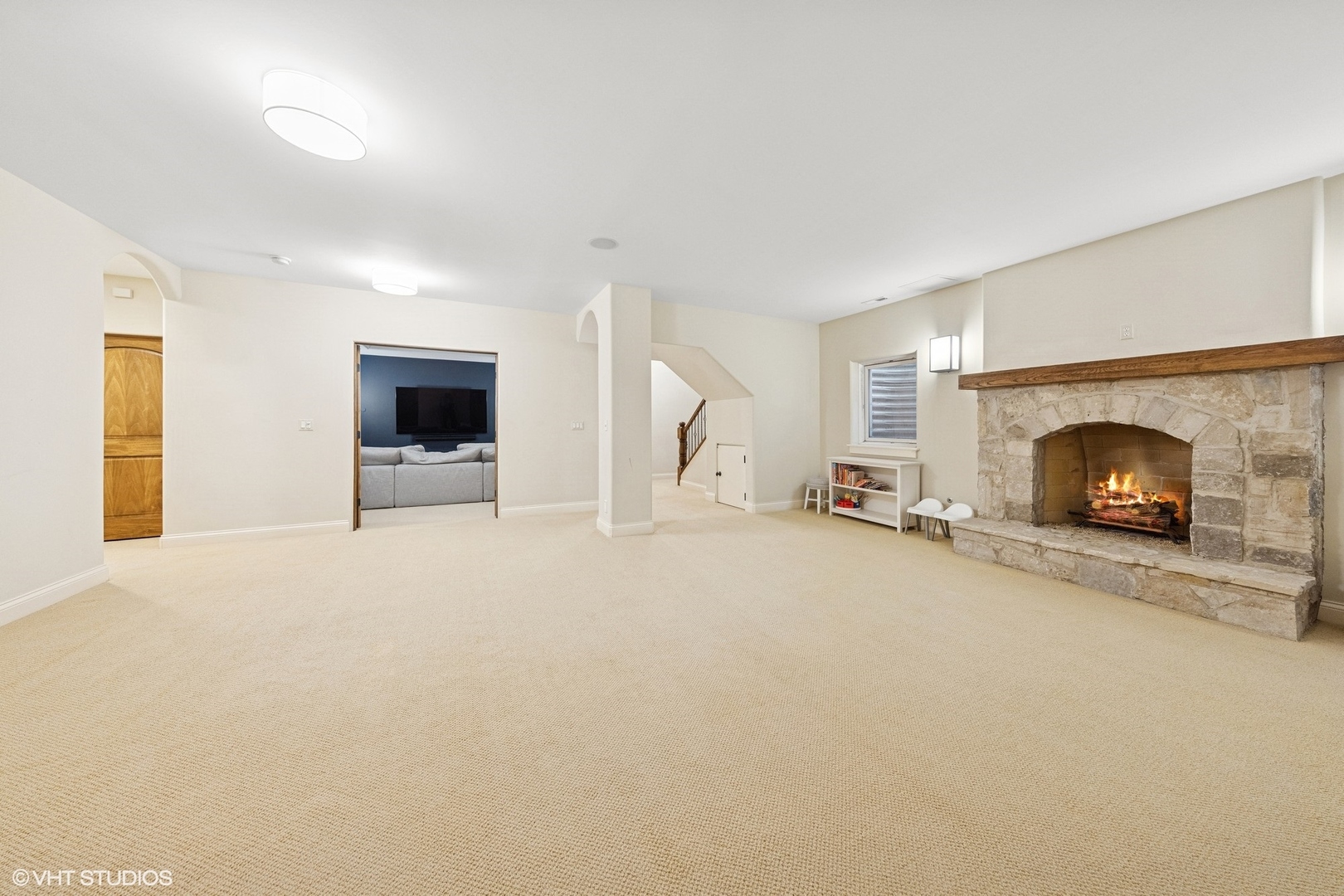 437 North County Line Road Hinsdale, IL 60521 - Photo 23 of 25 an empty room with a fireplace and window