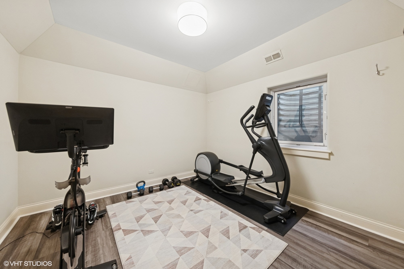 437 North County Line Road Hinsdale, IL 60521 - Photo 25 of 25 a room with gym equipment and a wooden floor