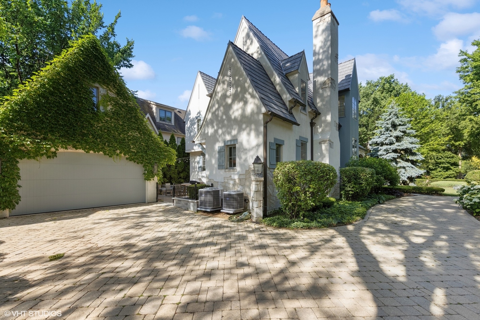 437 North County Line Road Hinsdale, IL 60521 - Photo 3 of 25 a view of a house with a yard and plants