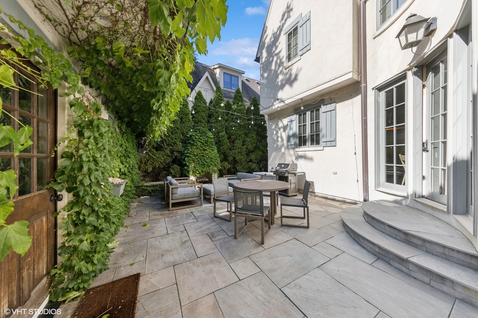 437 North County Line Road Hinsdale, IL 60521 - Photo 4 of 25 a backyard of a house with outdoor seating