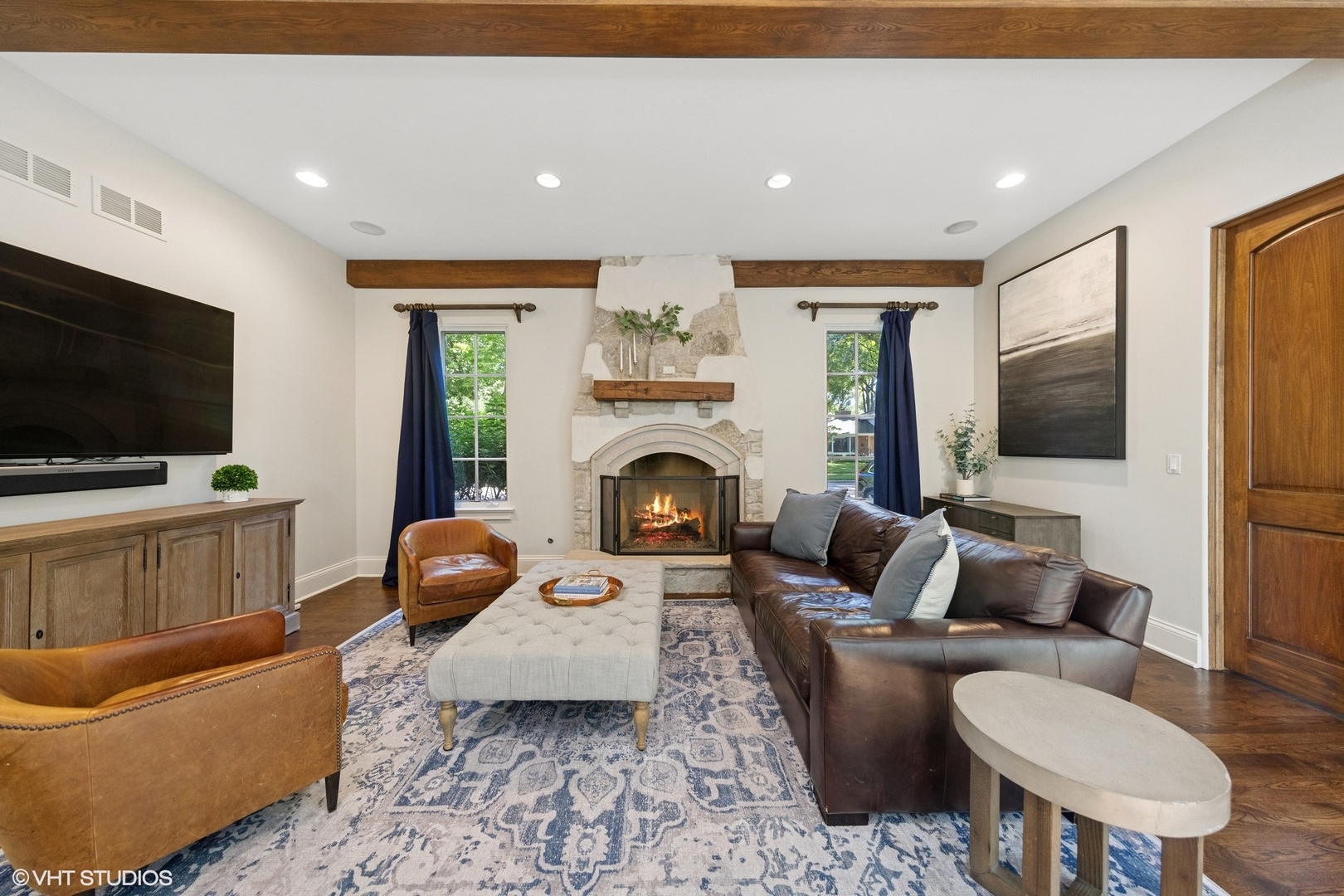437 North County Line Road Hinsdale, IL 60521 - Photo 5 of 25 a living room with furniture a flat screen tv and a fireplace