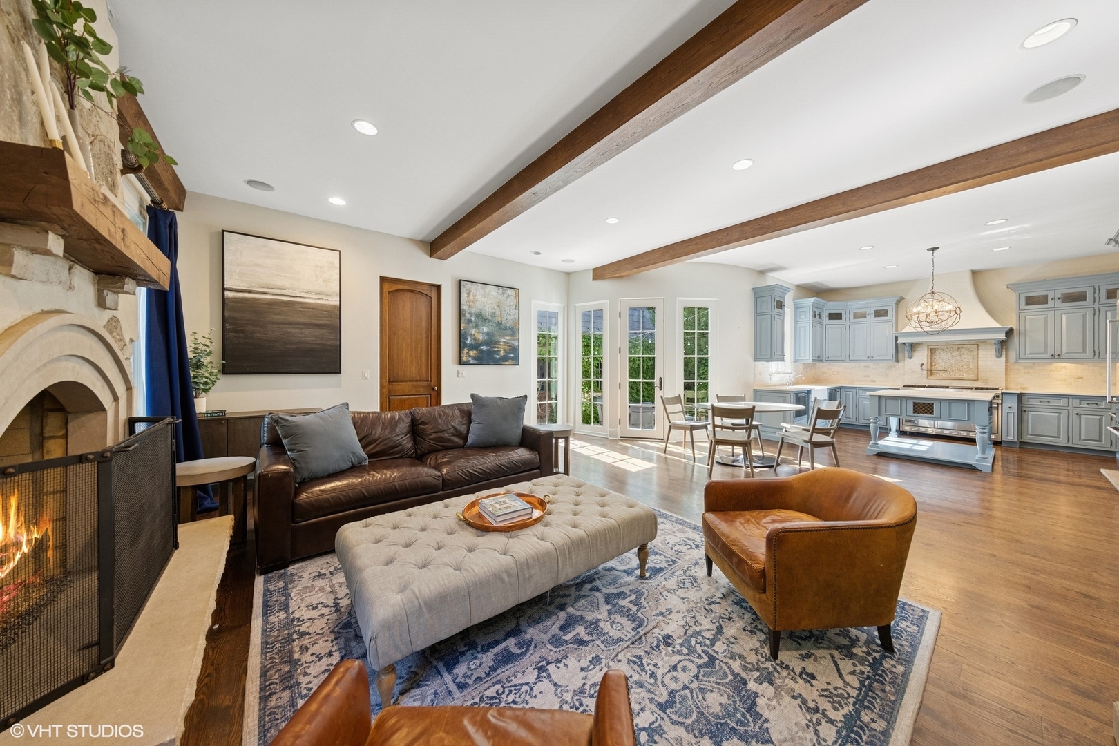 437 North County Line Road Hinsdale, IL 60521 - Photo 6 of 25 a living room with furniture a fireplace and a flat screen tv