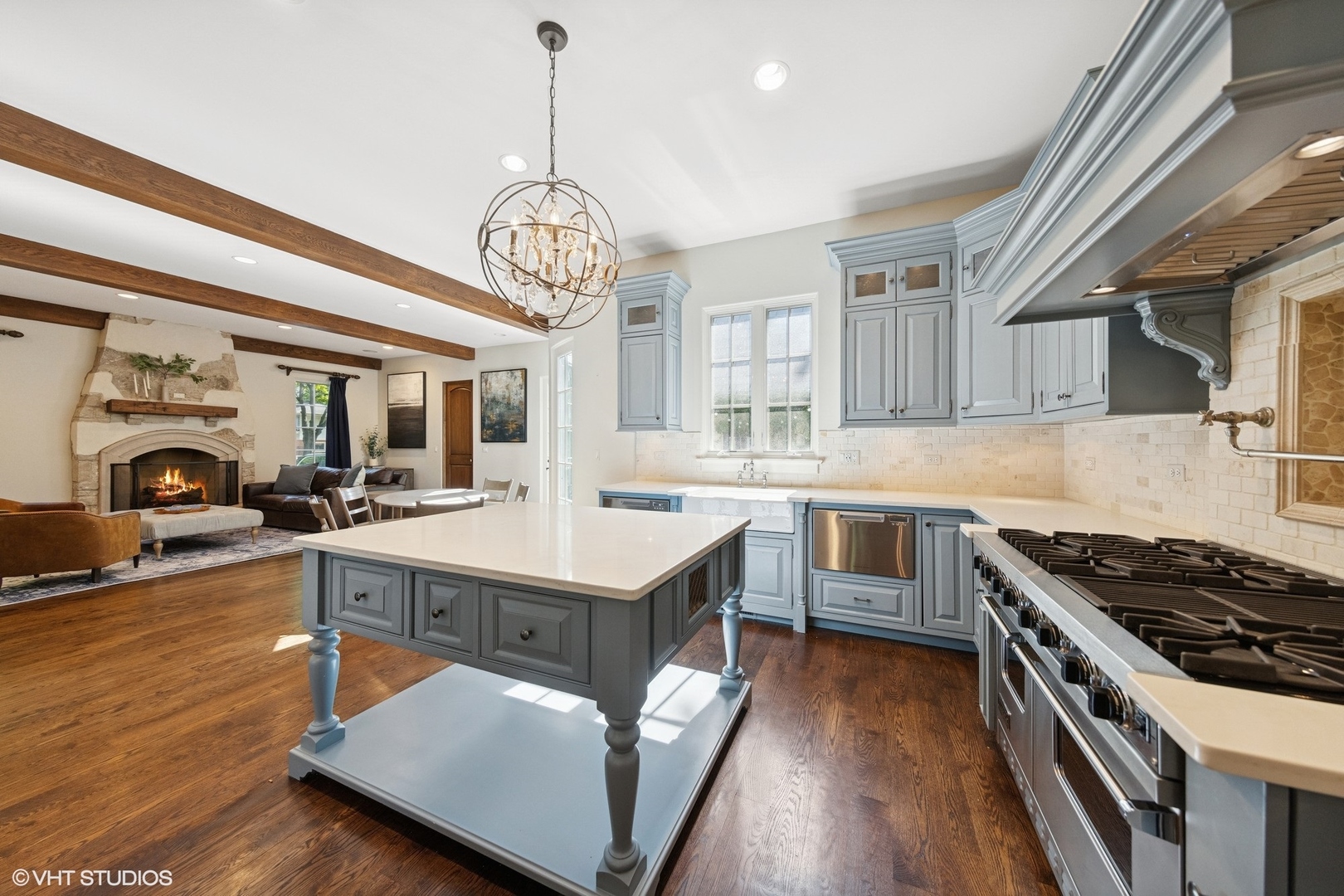437 North County Line Road Hinsdale, IL 60521 - Photo 7 of 25 a kitchen with stainless steel appliances granite countertop a sink a stove and a wooden floors
