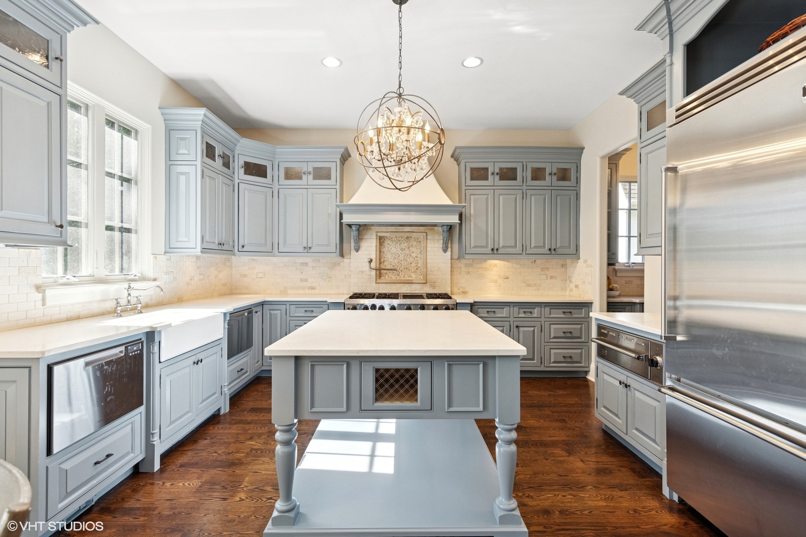 437 North County Line Road Hinsdale, IL 60521 - Photo 8 of 25 a kitchen with stainless steel appliances granite countertop a sink stove and refrigerator