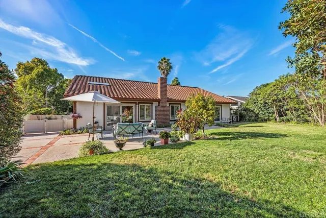 a sign board with parking space in back