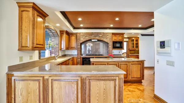 a kitchen with stainless steel appliances a sink and cabinets