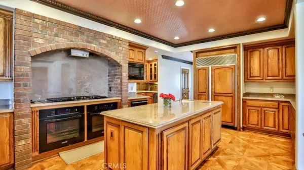 a kitchen with stainless steel appliances granite countertop a stove and a refrigerator