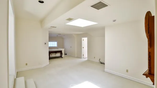 a view of a livingroom with furniture and a ceiling fan