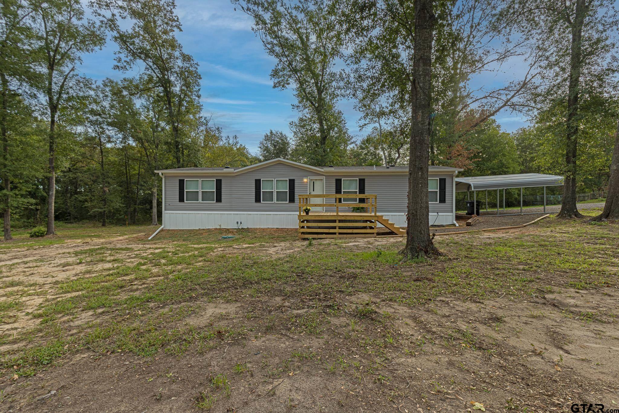 a view of house with outdoor space and seating area
