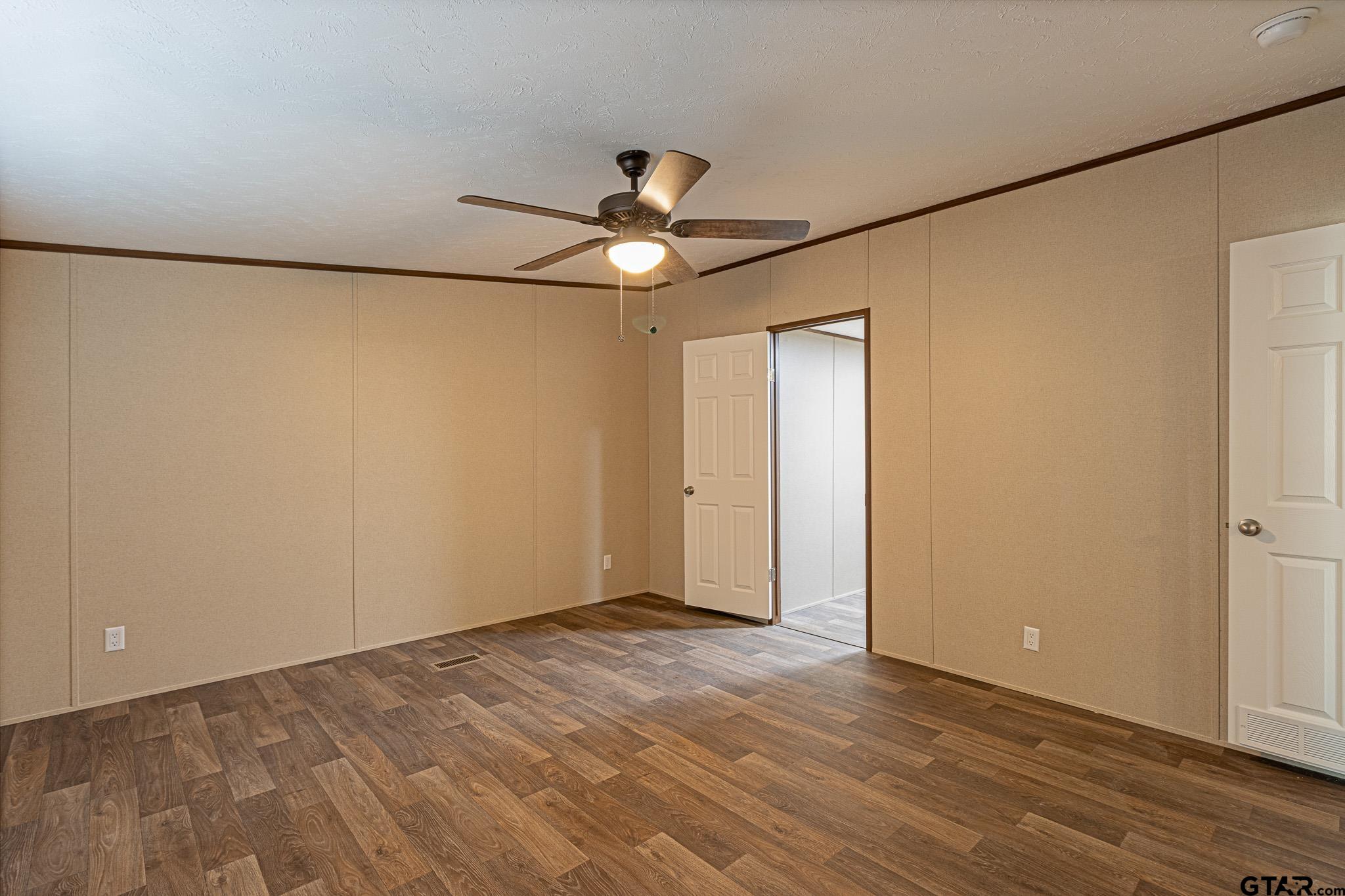 9806 FM 773 Murchison, TX 75778 - Photo 16 of 35 a view of an empty room and chandelier fan