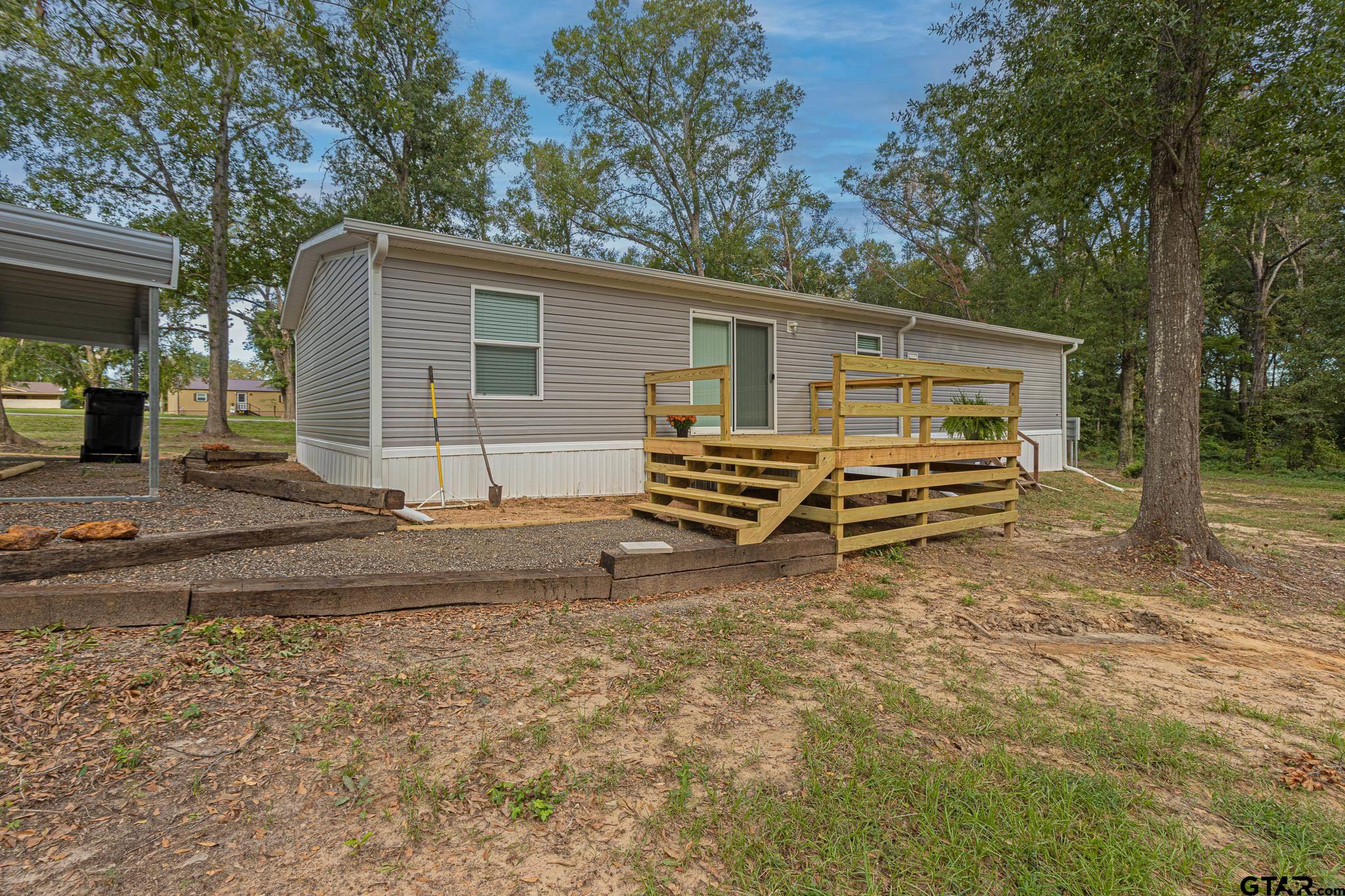 9806 FM 773 Murchison, TX 75778 - Photo 30 of 35 a house with trees in the background