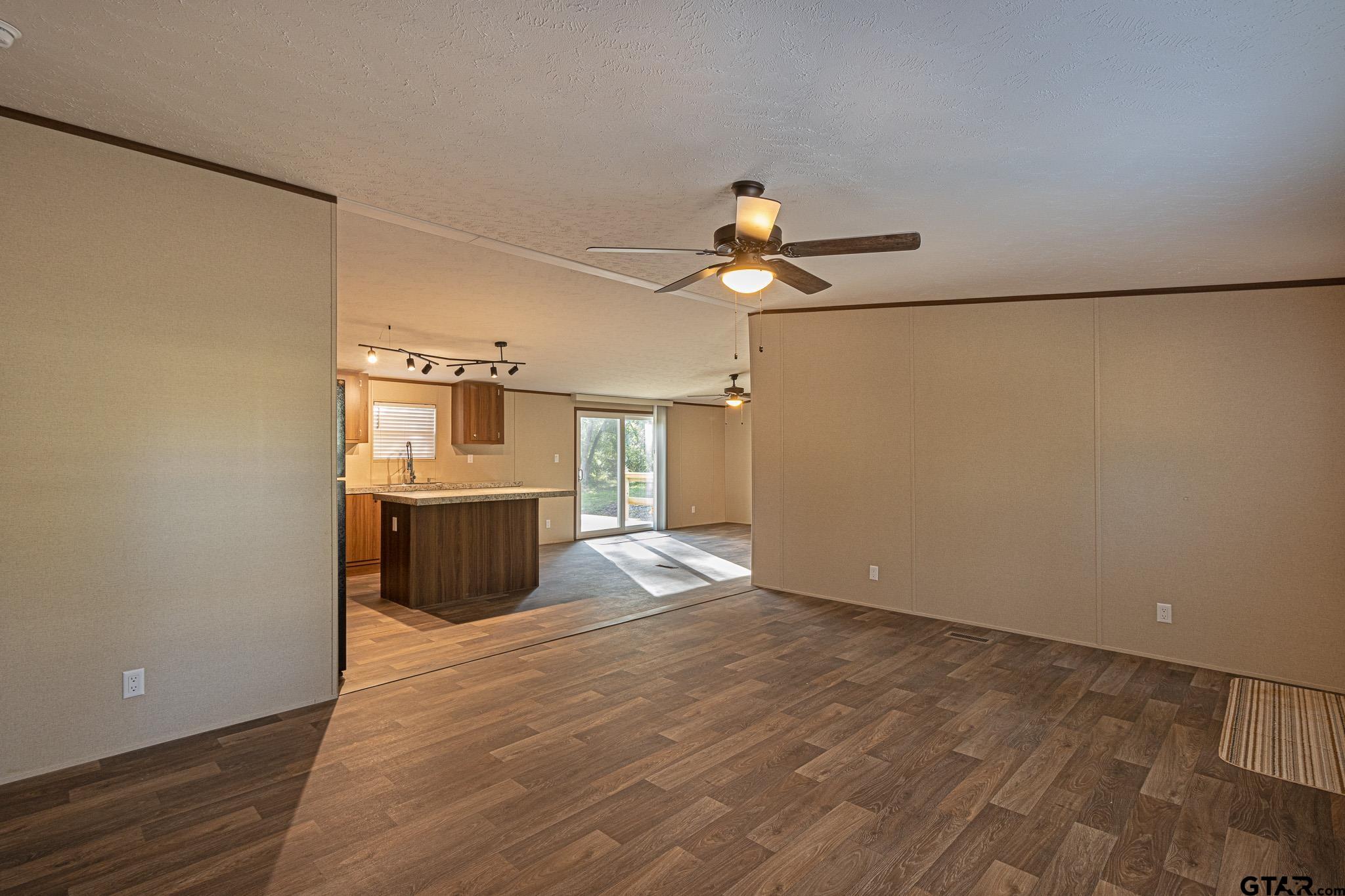 9806 FM 773 Murchison, TX 75778 - Photo 7 of 35 a view of a kitchen with a sink and a refrigerator