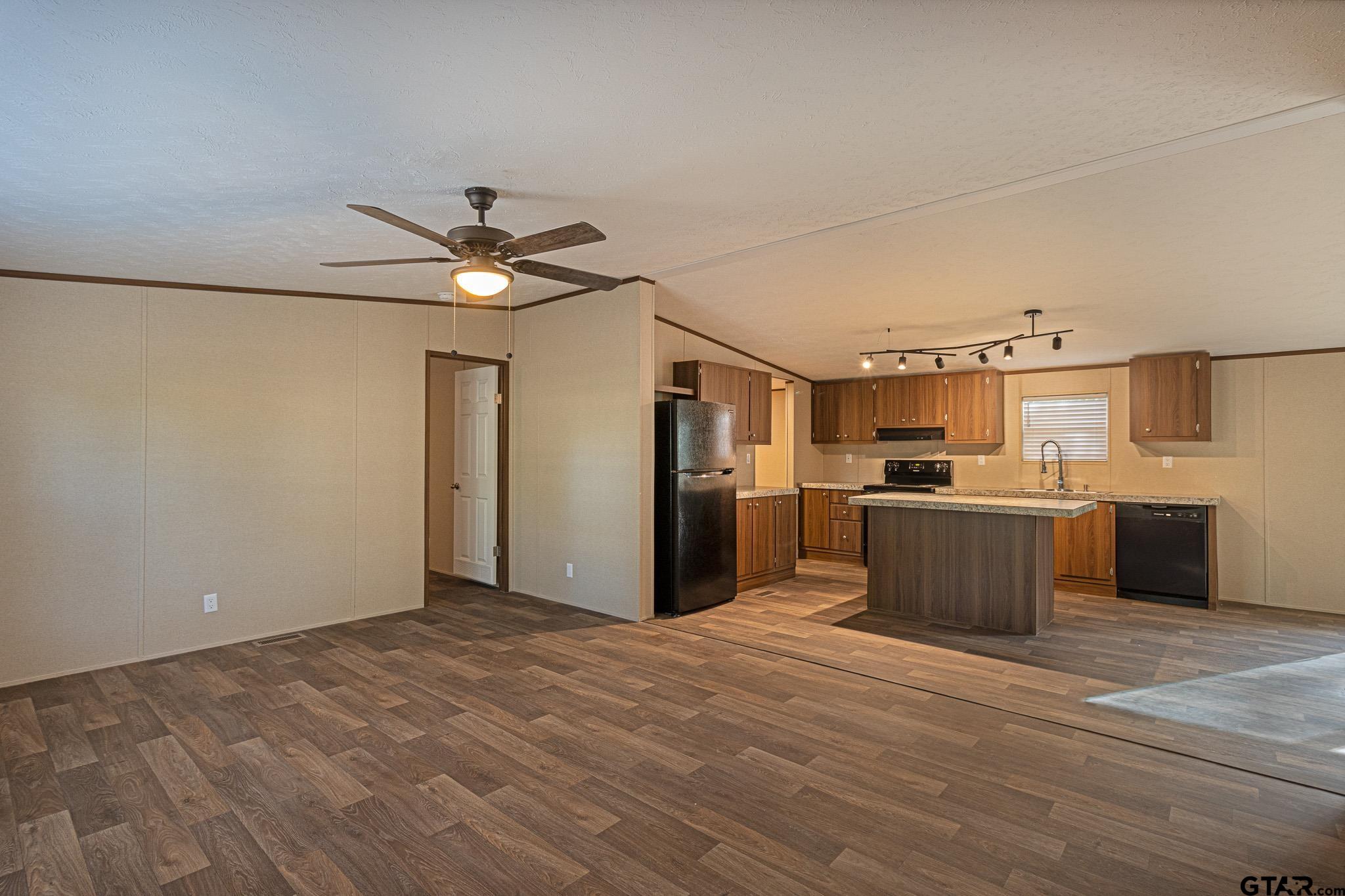 9806 FM 773 Murchison, TX 75778 - Photo 8 of 35 a view of a kitchen with wooden floor and a kitchen