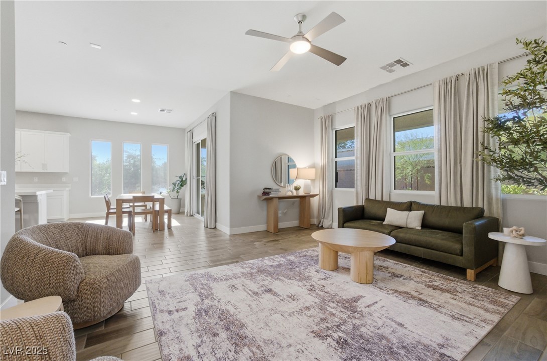 7736 Tioga Ridge Las Vegas, NV 89117 - Photo 14 of 68 Living room with light wood-style flooring, plenty of natural light, a ceiling fan, and recessed lighting