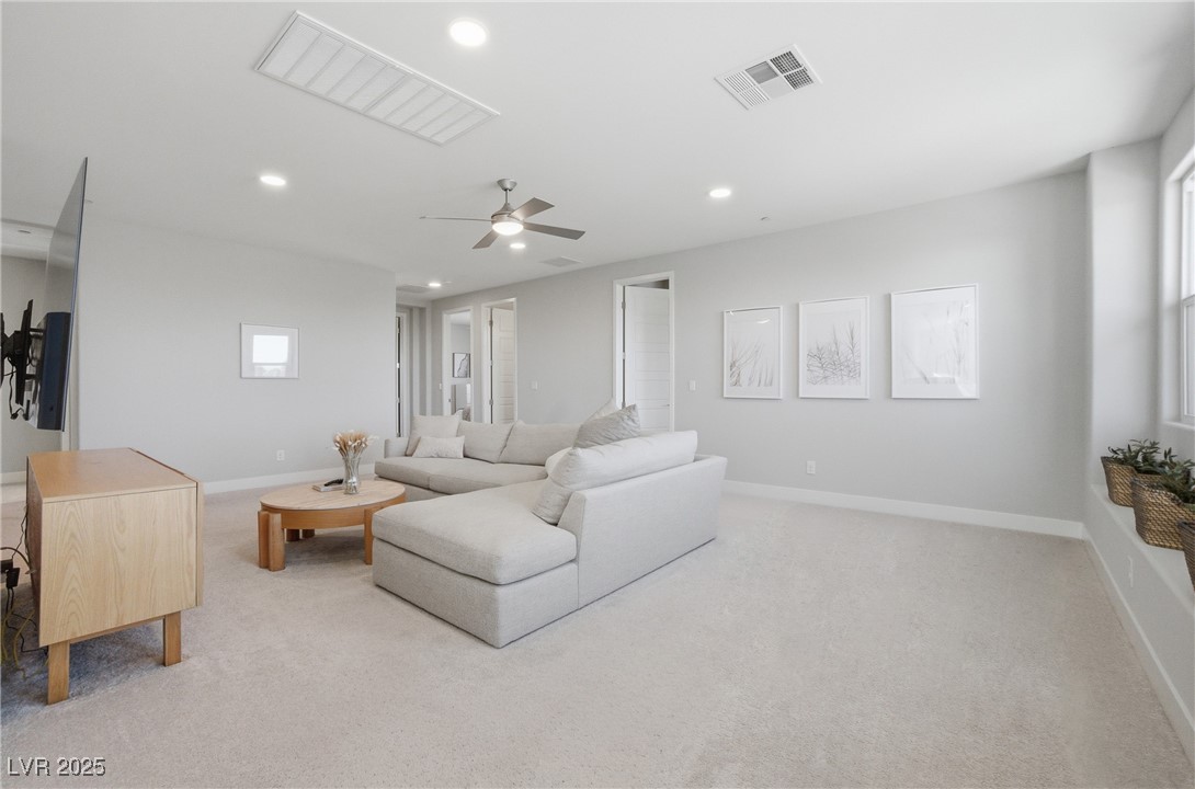 7736 Tioga Ridge Las Vegas, NV 89117 - Photo 17 of 68 Living room with light carpet, ceiling fan, and recessed lighting