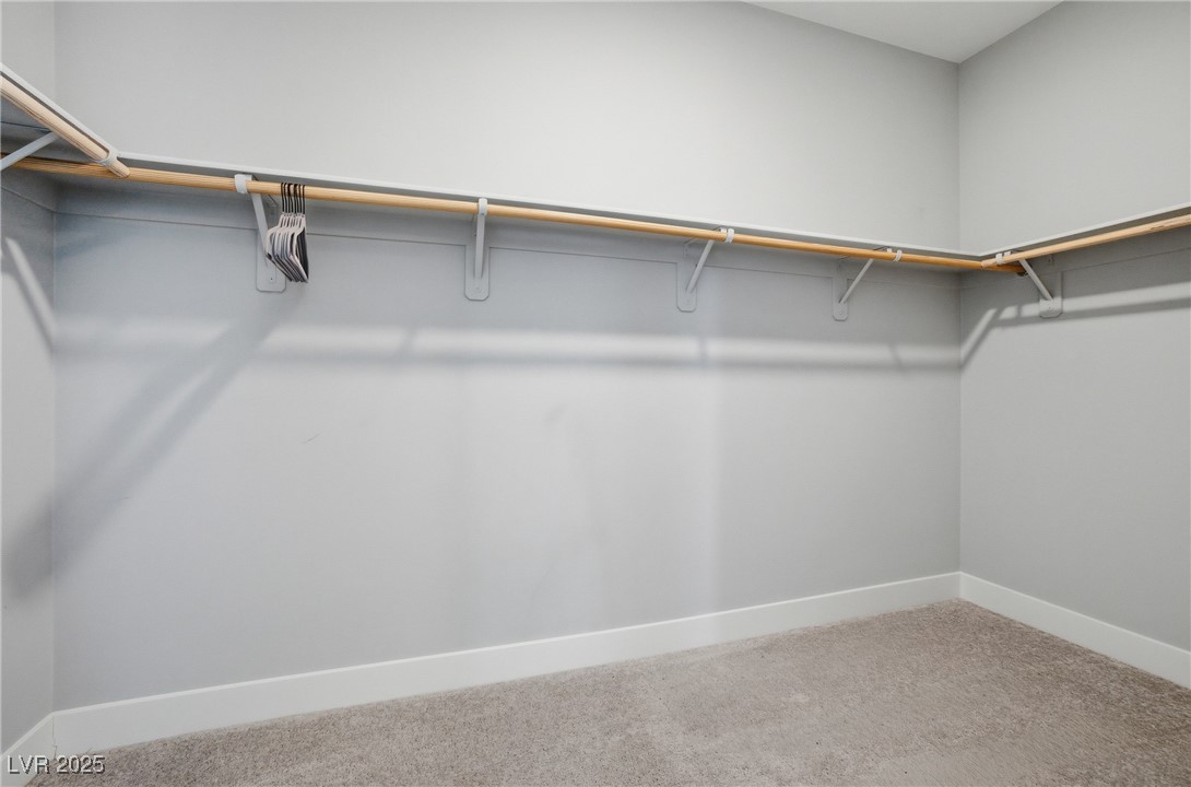 7736 Tioga Ridge Las Vegas, NV 89117 - Photo 28 of 68 Spacious closet with light carpet