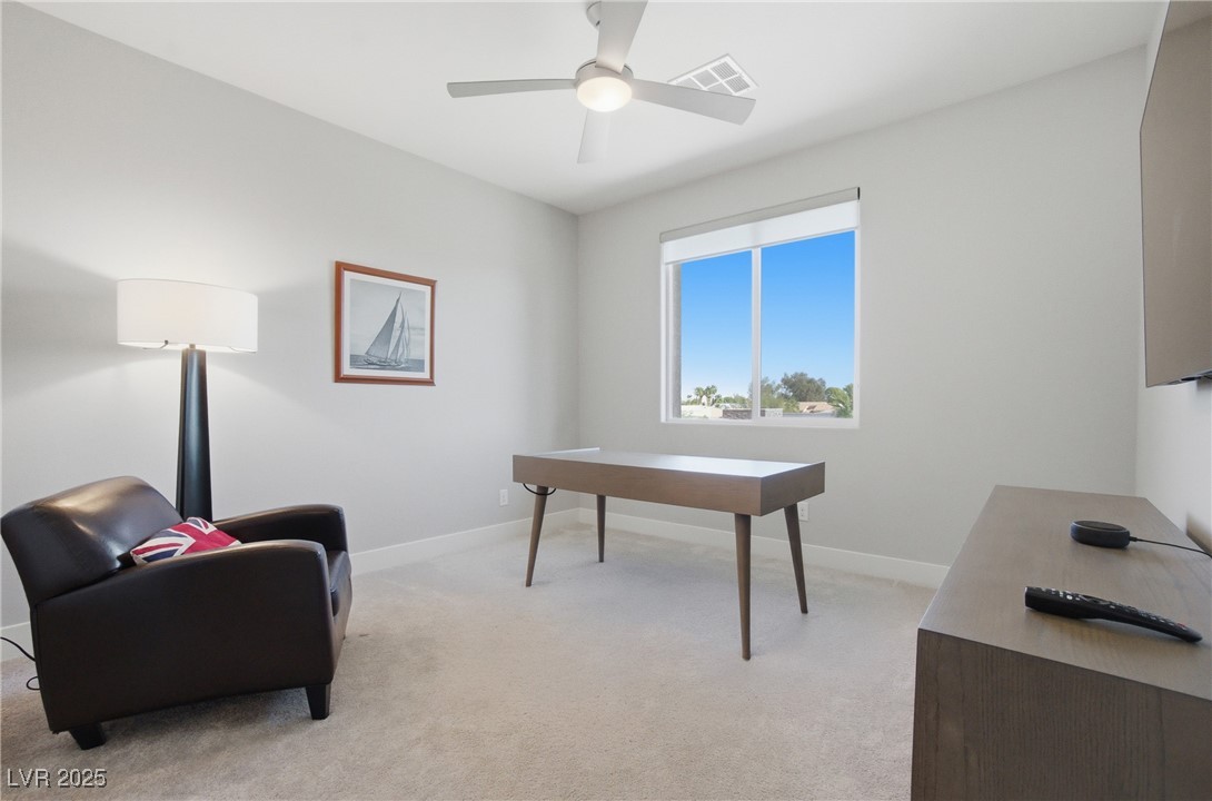 7736 Tioga Ridge Las Vegas, NV 89117 - Photo 31 of 68 Office featuring light carpet and a ceiling fan