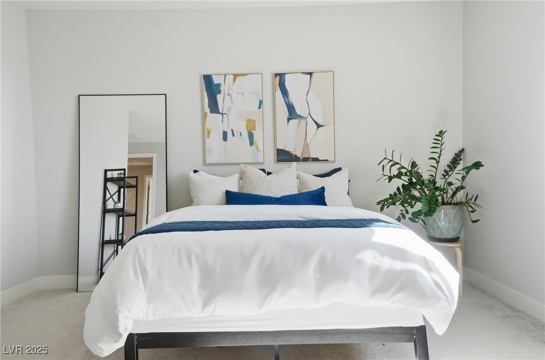 7736 Tioga Ridge Las Vegas, NV 89117 - Photo 35 of 68 Carpeted bedroom with baseboards